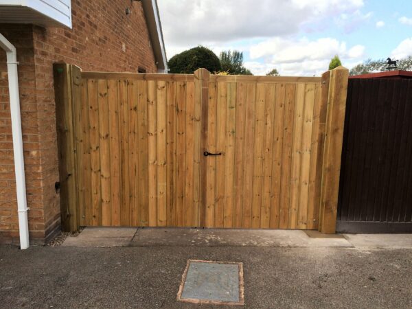 Morticed and tennoned tongue and groove gates in treated softwood scaled